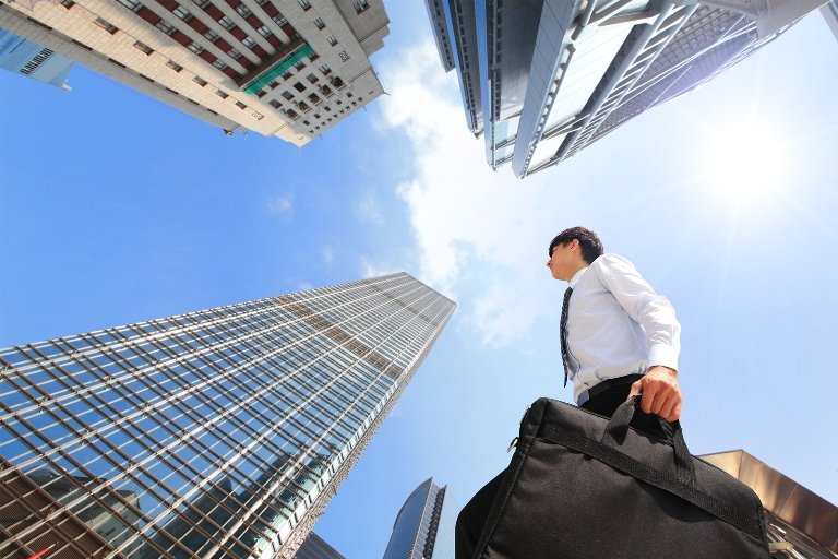 Successful Business Man Outdoors Next To Office Building